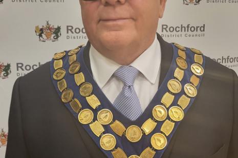 Cllr Jack Lawmon wearing a suit and ceremonial chain